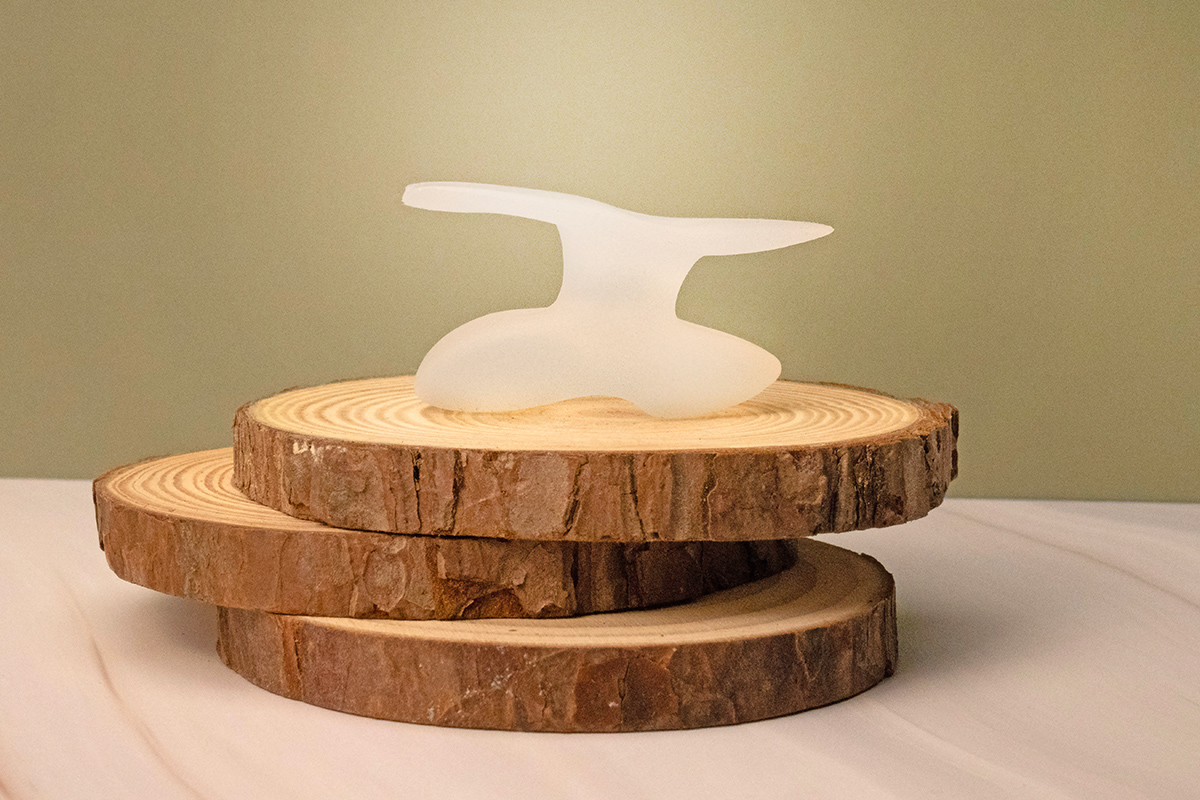 Klew Wellness product photo on woodstack on light green background.